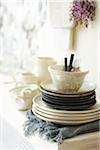 Close-up of Stack of Dishes on Sideboard in Dining Room