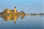 Schwerin Castle reflected in Schwerin Lake, Schwerin, Western Pomerania, Mecklenburg-Vorpommern, Germany