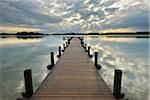 Wooden jetty on Lake Worthsee, Fuenfseenland, Upper Bavaria, Germany