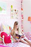 Girl reading in her room