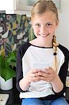 Portrait of girl holding cell phone