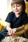 Boy eating popcorn
