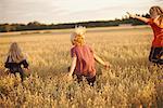 Children running through fields