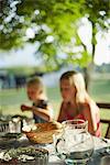 Girls eating meal in garden