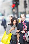 Women walking together on city street