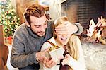 Couple exchanging gifts on Christmas