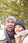 Couple admiring snow together