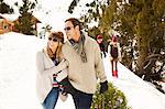 Couple walking through snow together