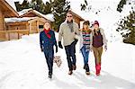 Family walking through snow together