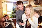 Man giving girlfriend jewelry for Christmas