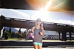 Woman running through city streets