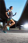 Woman running through city streets