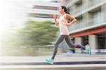 Woman running through city streets