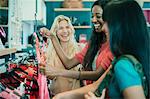 Women shopping together in clothing store