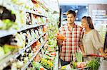 Couple shopping together in grocery store