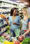 Women shopping together in grocery store