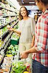 Couple shopping together in grocery store