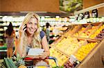 Woman talking on cell phone in grocery store