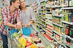 Couple shopping together in grocery store