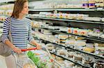 Woman shopping in grocery store