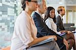 Business people sitting in office together