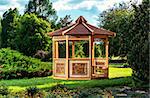 Outdoor wooden gazebo over summer landscape background