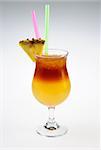 Alcohol cocktail with slice of pineapple over white background