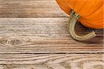 weathered plank wood background with a pumpkin