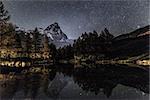 Matterhorn and Blue Lake in an autumn night with starry sky