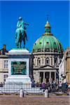 Statue of King Frederik V in Amalienborg Palace Square with Frederik's Church (known as The Marble Church) in the background, Frederiksstaden, Copenhagen, Denmark