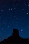 Silhouetted butte against night sky, Valley of the Gods, Utah, USA