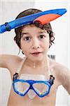 Boy Standing in Shower with Diving Mask and Snorkel
