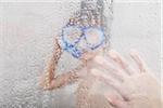 Boy Standing in Shower wearing Diving Mask and Snorkel