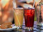 Two Drinks on Patio Table with Cookie and Bottle of Water, Dundas, Ontario, Canada