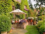 View of private garden and patio of home in summer, Toronto, Ontario, Canada