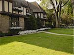 View of house exterior and front garden in summer, Toronto, Ontario, Canada