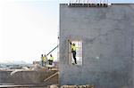 Site manager checking doorway on construction site