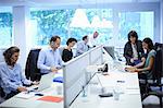 Business team at their desks in busy office