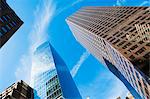 Low angled view of office blocks in financial district, Manhattan, New York, USA