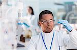 Scientist examining test tube in laboratory