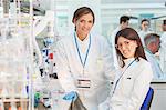 Scientists smiling in laboratory