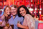 Portrait of smiling mature man and women in nightclub