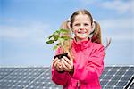Girl holding plant environmental protection