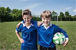 Friends boys young football players portrait