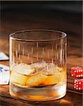 Glass of Scotch on Ice with Dice and Cards, Studio Shot