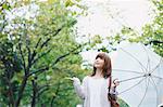 Portrait of young Japanese woman in a park