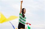 A woman on a beach in Kobe.