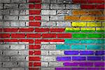 Dark brick wall texture - coutry flag and rainbow flag painted on wall - England