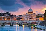 View of St. Peter's cathedral in Rome, Italy during beautiful sunset.