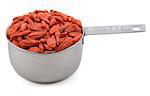 Red goji berries in an American cup measure, isolated on a white background